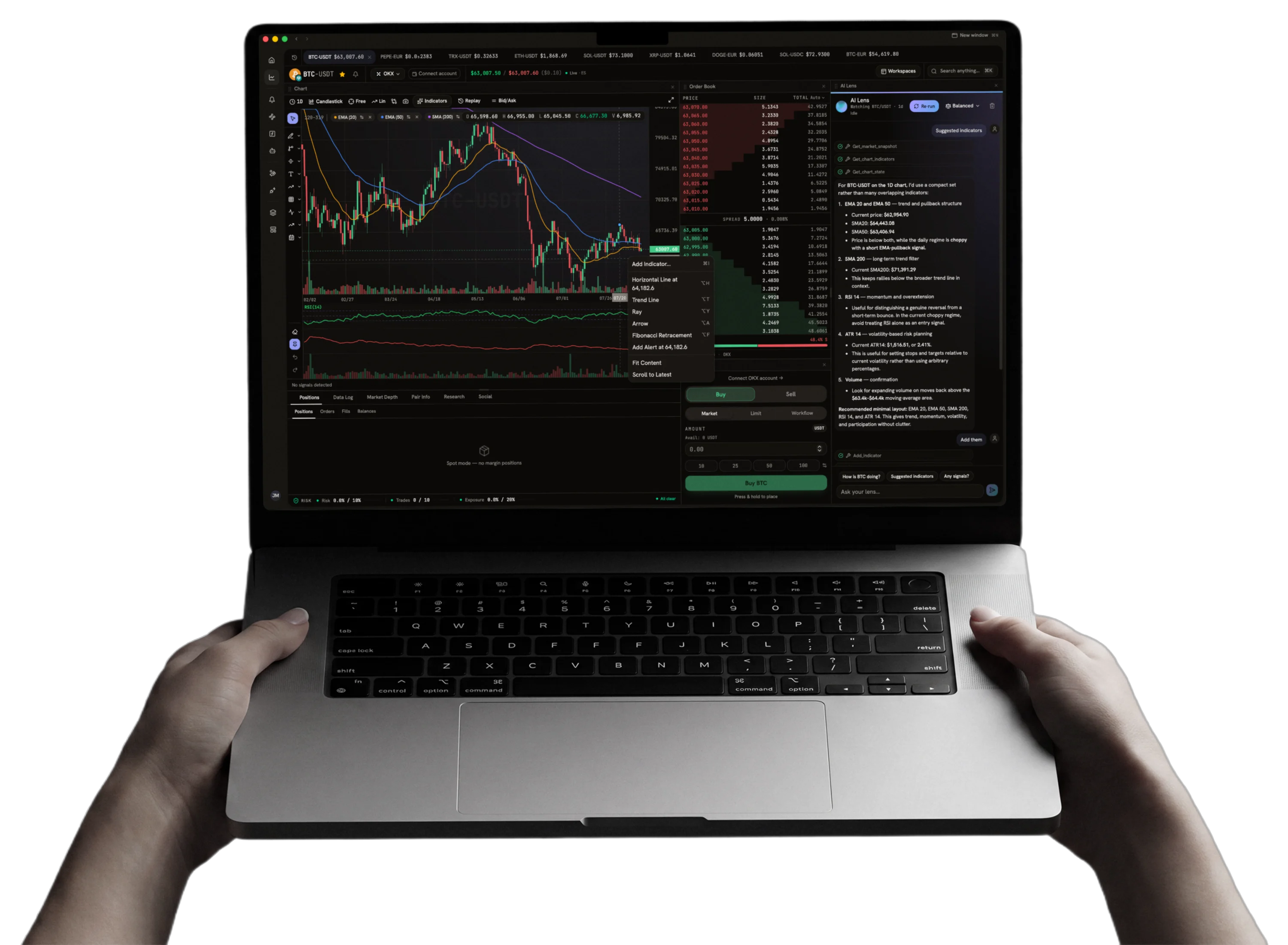 Two hands holding a MacBook Pro running the Pairlens trading terminal: a BTC-USDT candlestick chart with EMA overlays, an order book, and the AI assistant suggesting indicators beside them